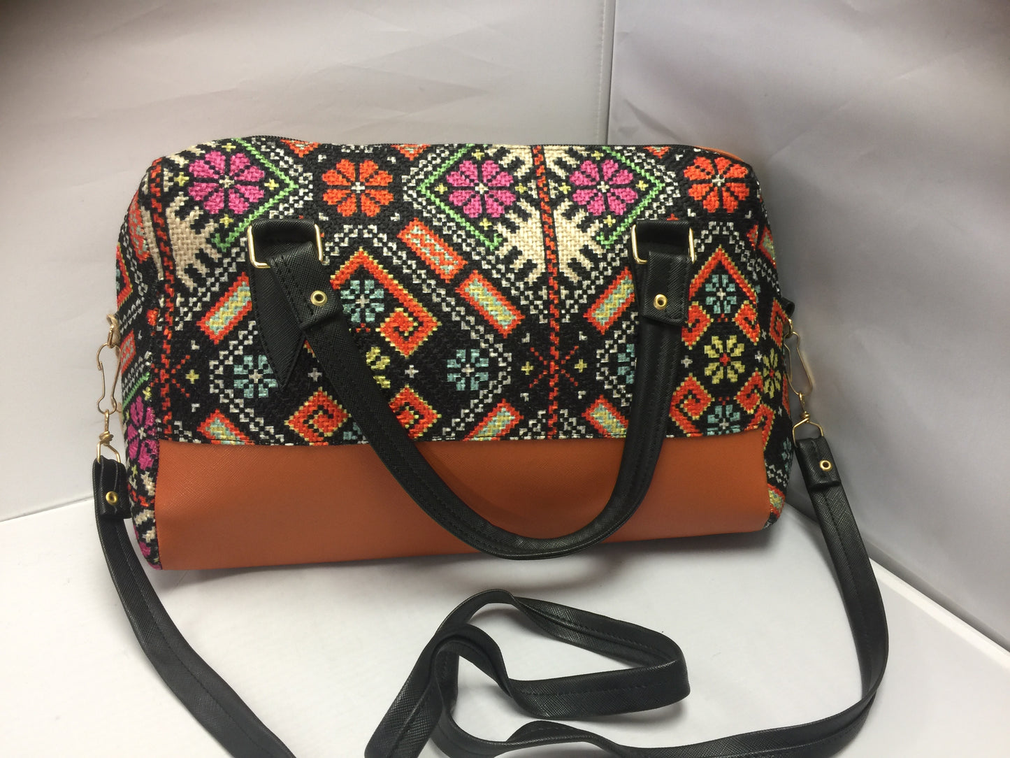 Handbag with native designs orange and black